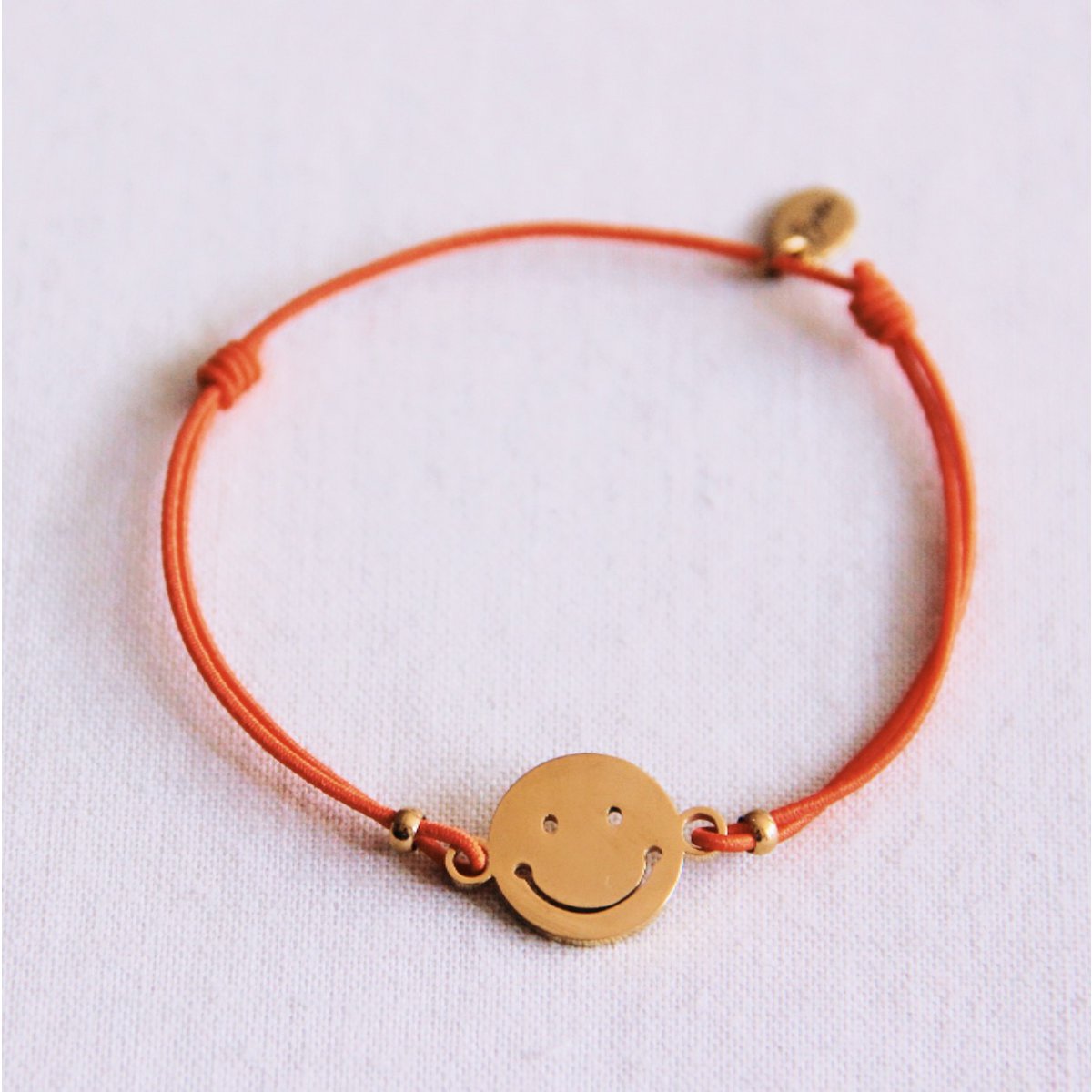 Elastisches Armband mit Smiley - Orange